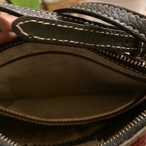 A brown and tan Donney & Bourke clutch purse